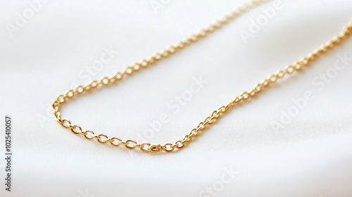 Elegant Gold Chain on Soft Fabric Background