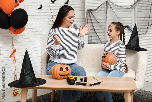 Little girl with pumpkin an...