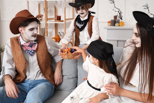 Happy family with candies c...