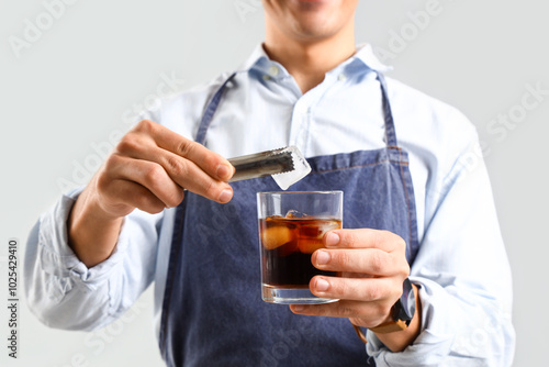 Male bartender preparing co...