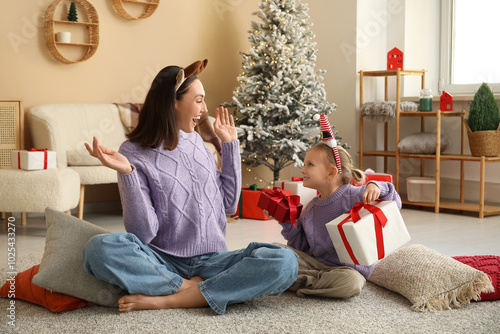 Cute little girl giving her...
