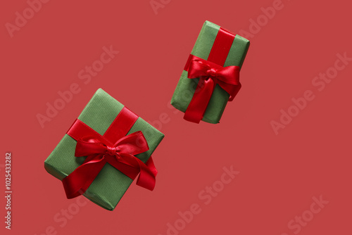 Flying gift boxes on red background