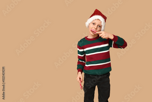 Cute little boy in Santa ha...