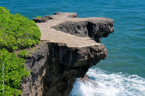 Ocean waves crashing against jagged cliffs, emphasizing the raw, untamed power of the sea