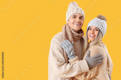 Happy young couple in winte...