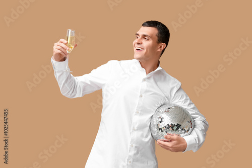 Happy young man with glass ...
