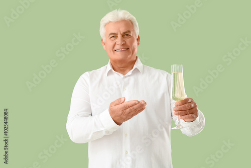 Senior man with glass of ch...