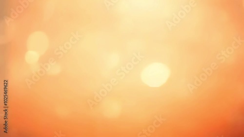 Soft golden bokeh lights on a warm orange gradient background. Abstract blurred effect for festive or celebratory designs. 4K background material for loop playback