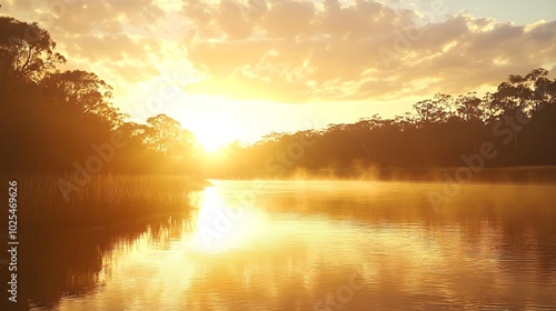 The golden hour light reflecting off the surface of a tranquil river as a hazy sunset fades into the humid air, creating a serene and peaceful scene. 