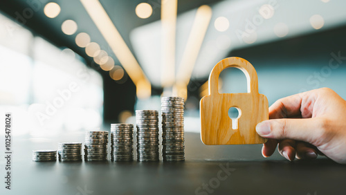 The symbol of the lock and pile of money represents the stability of the currency and interest on deposits and loans. photo