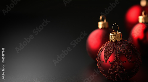 Beautiful red ornaments with intricate designs shine softly in low light, adding a touch of elegance to Christmas decorations during the festive season, copy space