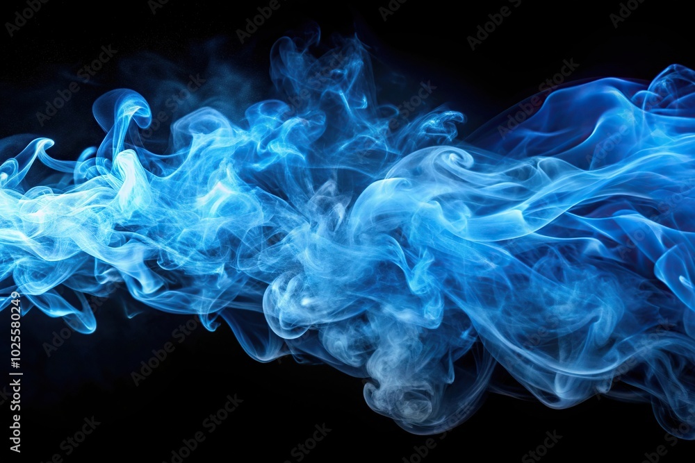 Obraz premium Dynamic flowing blue smoke on black background