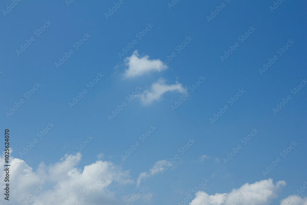 Blue sky and white puffy clouds
Blue sky and white puffy clouds
