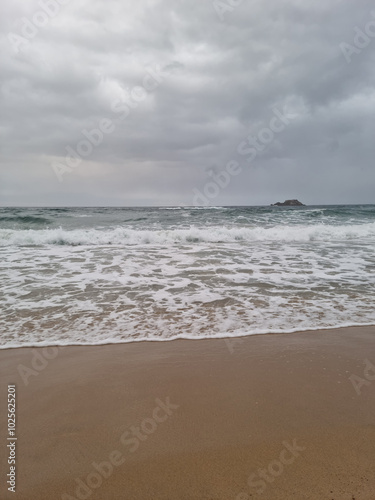  It is Sampo Beach under a cloudy sky.