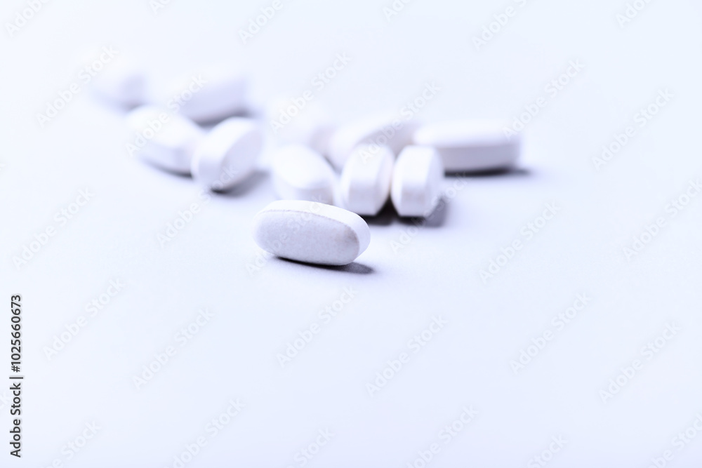 Amino acids tablets. Nutrition for bodybuilding. Fitness supplements on bright background. Soft focus. Copy space. Amino acids tablets. Nutrition for bodybuilding. Fitness supplements on bright background. Soft focus. Copy space.