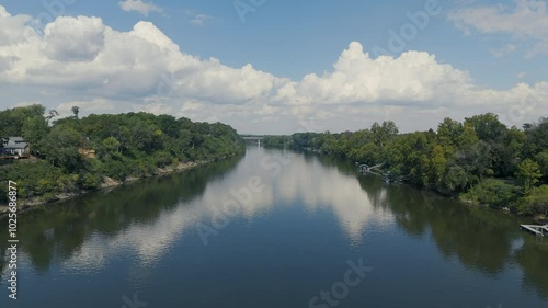 Aerial-Flying over Cumberland River-White clouds-Freeway bridge in the far distance
