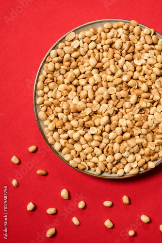 Honey drizzeled nuts on a red backdrop photo