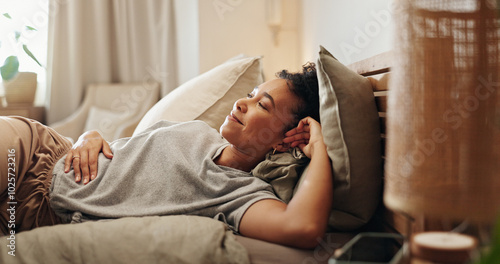 Woman, thinking and relax in bedroom, comfortable and morning peace for reflection in home. Female person, happy and chilling on bed for contemplating, apartment and ponder perspective on weekend