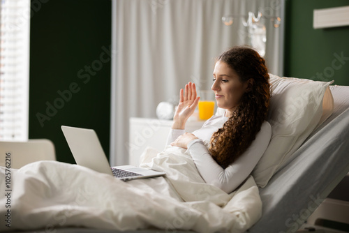 Patient takes a break by watching her favorite shows on the tablet, bringing moments of joy during recovery.