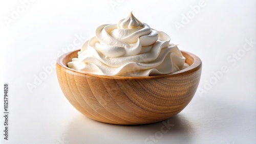 Close-up of whipped cream in a wooden bowl on a white background