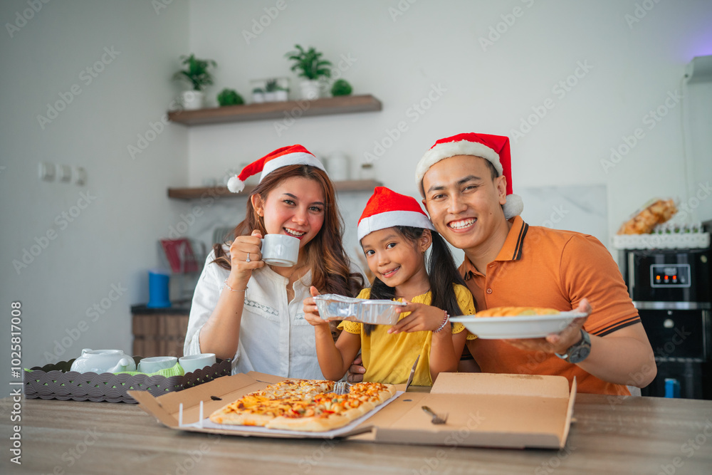 potrait of happy asian family having christmas dinner together in dining room potrait of happy asian family having christmas dinner together in dining room