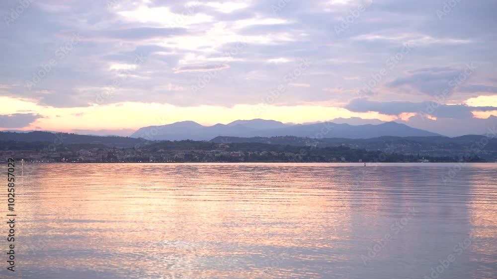 Clouds reflecting on lake surface at sunset Clouds reflecting on lake surface at sunset