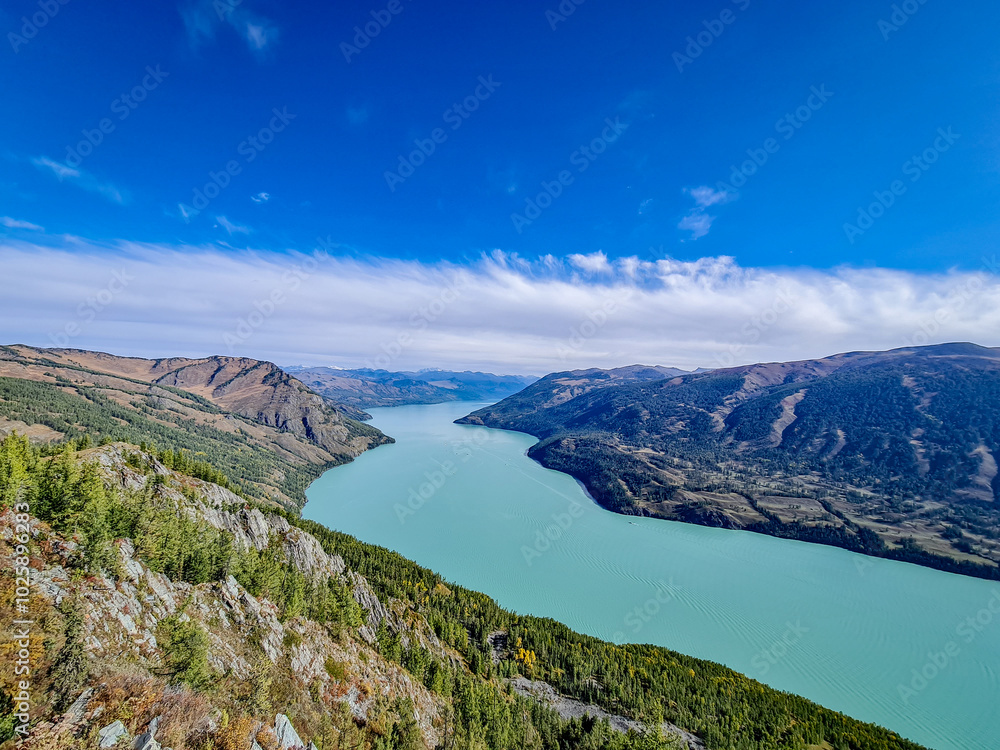 Fototapeta premium kanasi lake landscape or mountain view, scenery of mountain in China, travel destination or tour tourism, xinjiang, majestic panorama nature view. destination, blue sky, hill top, calmness.