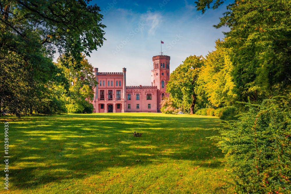 Obraz premium Stunning morning view of Vecauces castle, Latvia, Europe. Colorful summer scene of Vecauce village. Traveling concept background.