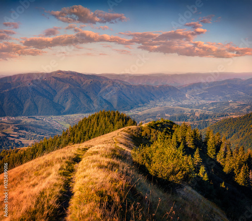 Down footpath to Kolochava village. Fantastic morning scene of Carpathian mountains, Ukraine, Europe. Exciting autumn sunrise. Beauty of nature concept background.