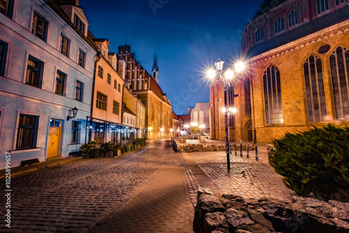 Fantastic night citryscape of Riga tovn. Vibrant Vecriga, the old town, is home to churches like the medieval Riga Cathedral and St. Peter's Church, with a towering steeple, Latvia, Europe.