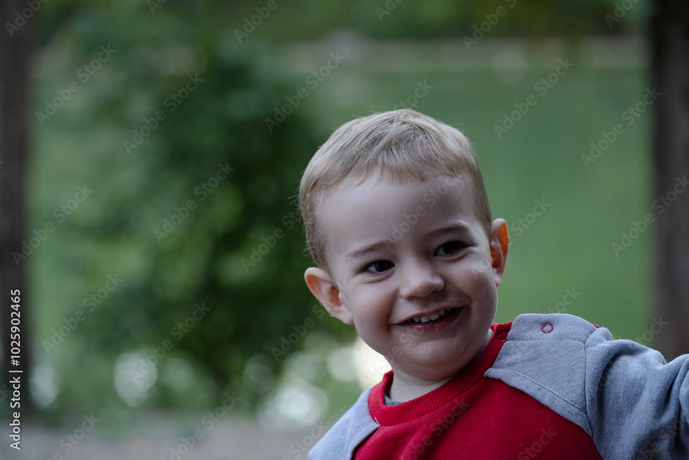 close-up of smiling child with blurred background close-up of smiling child with blurred background