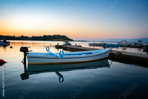 Fototapeta Naklejka Na Ścianę i Meble -  blue fishing boat, harbor, croatia, sunset, nin, romantic