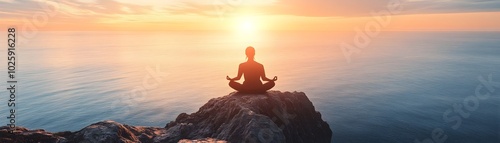 Person Meditating on Cliff ...