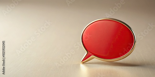 A sleek red speech bubble pin on a plain backdrop, designed for effective visual communication, captures attention and conveys messages with minimalist elegance.