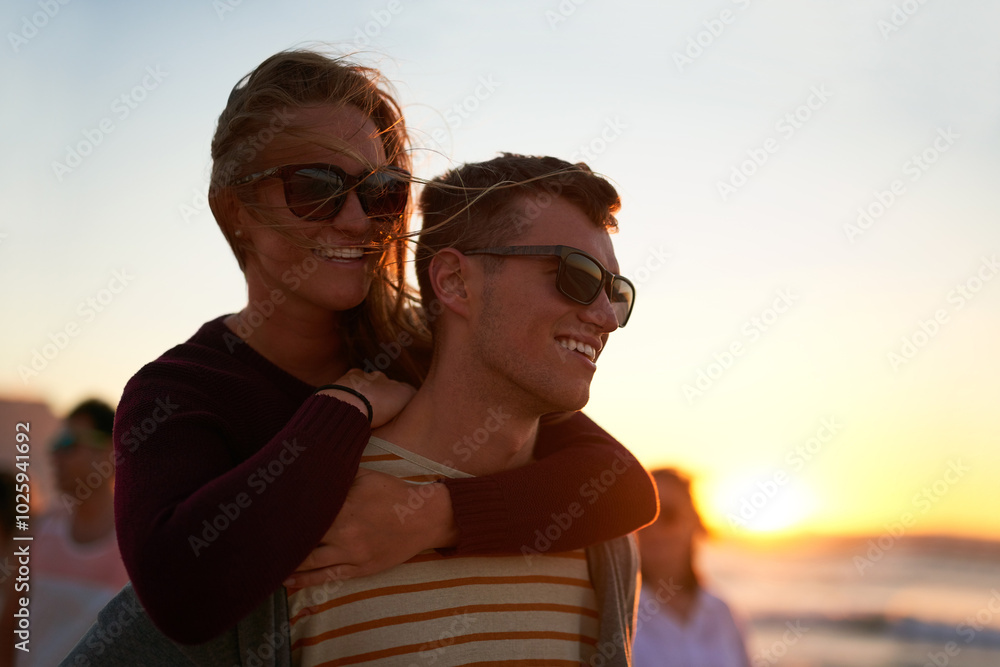Couple, piggyback and relax at beach for sunset, travel and tropical holiday together with sunglasses. Man, woman and bonding by ocean for trip, romance and summer vacation with weekend date in Ibiza Couple, piggyback and relax at beach for sunset, travel and tropical holiday together with sunglasses. Man, woman and bonding by ocean for trip, romance and summer vacation with weekend date in Ibiza