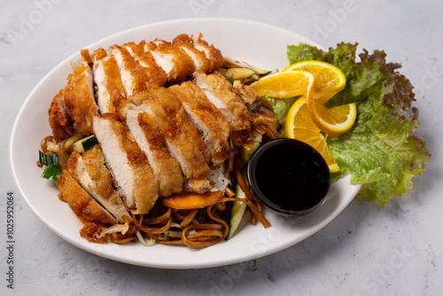 Asian fried chicken with vegetables and coconut sauce