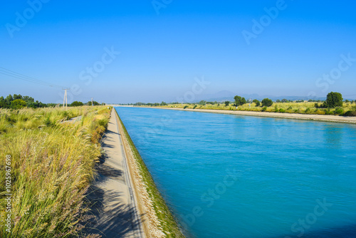 The Vologda River and the Church of St. John Chrysostom on a summer sunny day, Ghazi Barotha canal Water canal, Flowing clean river canal with scenic sky, clouds, hills, greenery and road. photo