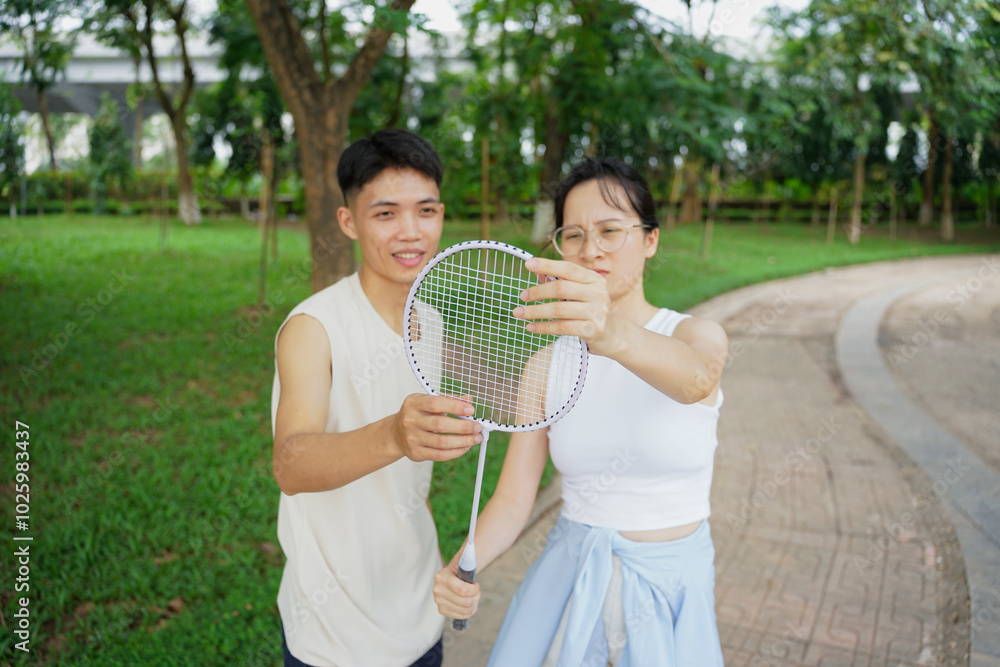 Fototapeta premium Two young Asian classmate playing at park after school