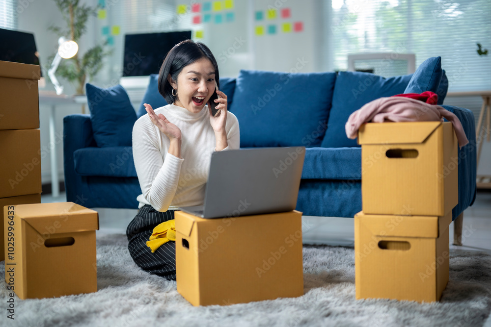 A woman is sitting on the floor in front of a laptop and talking on the phone A woman is sitting on the floor in front of a laptop and talking on the phone
