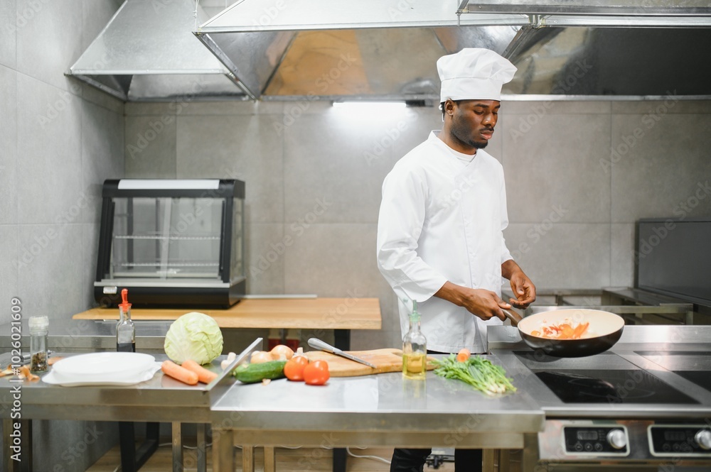 handsome african american chef at restaurant kitchen