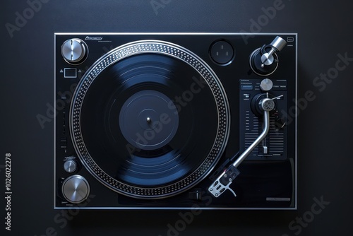 Turntable playing vinyl record in a dimly lit room at night