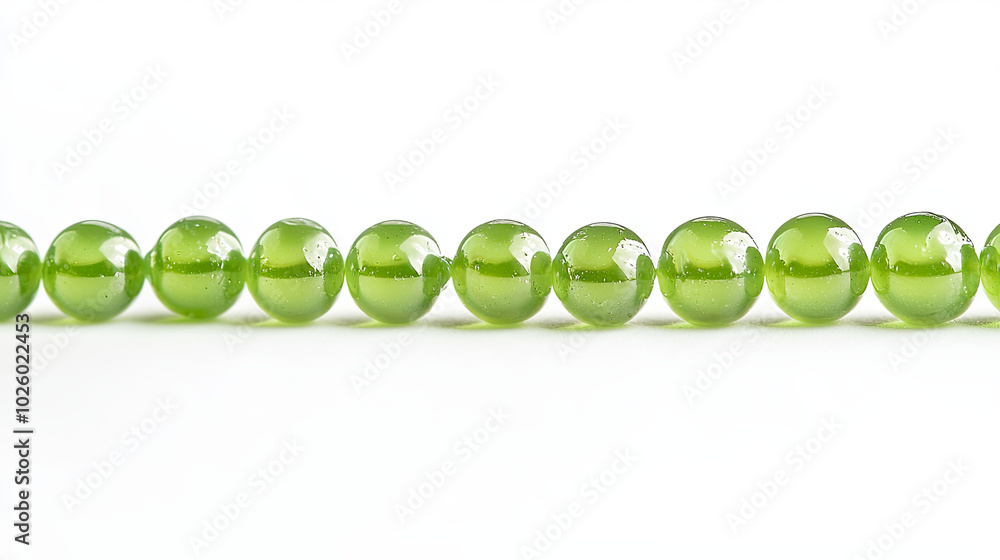 string of green glass beads isolated on white background, showcasing their glossy surface and vibrant color. Perfect for jewelry design or decoration string of green glass beads isolated on white background, showcasing their glossy surface and vibrant color. Perfect for jewelry design or decoration