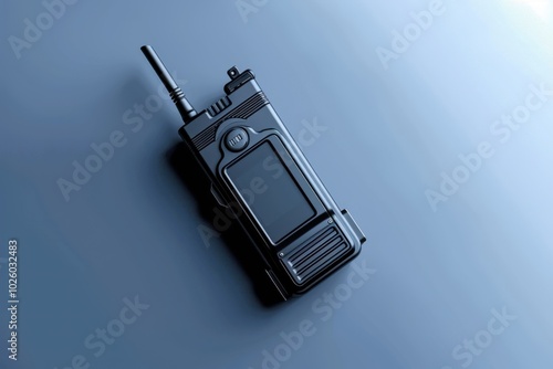 Black walkie-talkie on a sleek blue surface with a modern design photo