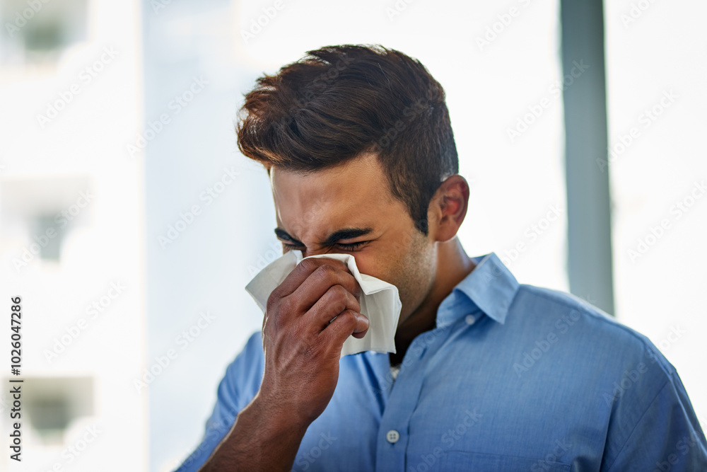 Blowing, nose and sick business man in office with flu virus, allergies and health problem at workplace. Professional, ill employee and sneeze in tissue for medical disease, sinusitis and hayfever Blowing, nose and sick business man in office with flu virus, allergies and health problem at workplace. Professional, ill employee and sneeze in tissue for medical disease, sinusitis and hayfever