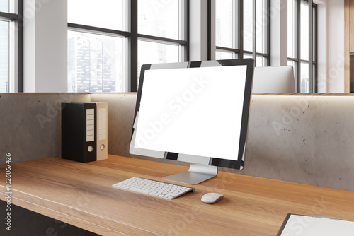 Office coworking interior with pc computer on table with mockup display, window