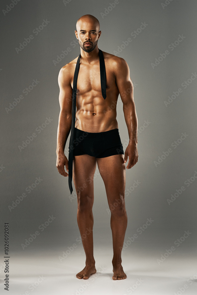 Studio, man and portrait with confidence for underwear, fashion and muscular with pride. Space, male person and sexy model with necktie by gray background, shirtless and fitness body with abs Studio, man and portrait with confidence for underwear, fashion and muscular with pride. Space, male person and sexy model with necktie by gray background, shirtless and fitness body with abs