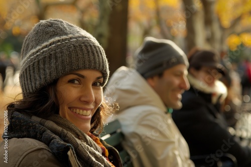 Portrait of a beautiful young woman with hat and scarf in autumn park