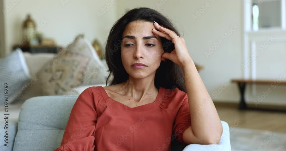 Young Latina woman feels disappointed about bad news, encountering troubling situation, thinking, sit alone at home, experiencing stress or anxiety, facing challenges, reflecting on life difficulties Young Latina woman feels disappointed about bad news, encountering troubling situation, thinking, sit alone at home, experiencing stress or anxiety, facing challenges, reflecting on life difficulties
