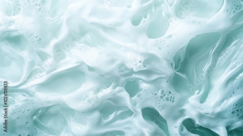 An ethereal close-up view of turquoise ocean waves adorned with frothy, foam patterns, showcasing the ocean's elegance, dynamism, and soothing qualities.