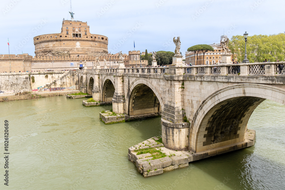 Obraz premium Rome, Italy - April 09, 2024: Castel Santo Angelo in Rome with tourists crowding its surroundings in Rome, Italy
